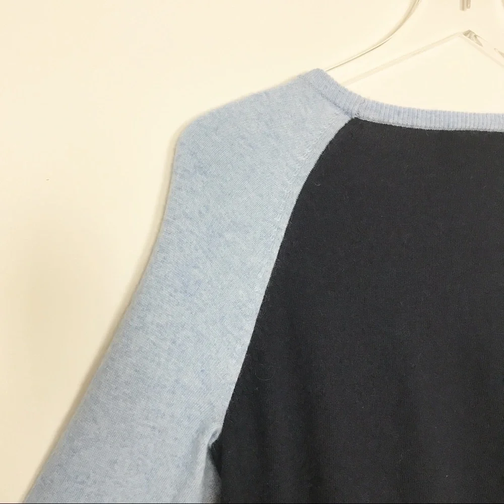 J. Crew two-toned sweater with functional buttons